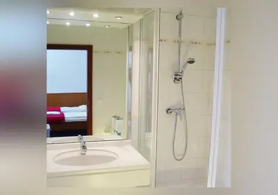 Ein Badezimmer in der Unterkunft Hotel Waldhusen - Adults Only