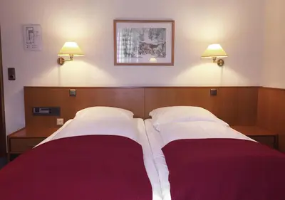 Ein Bett oder Betten in einem Zimmer der Unterkunft Hotel Waldhusen - Adults Only