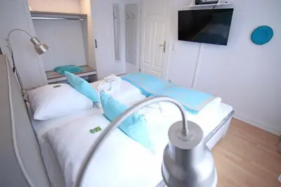 Ein Bett oder Betten in einem Zimmer der Unterkunft WellenRausch Living 