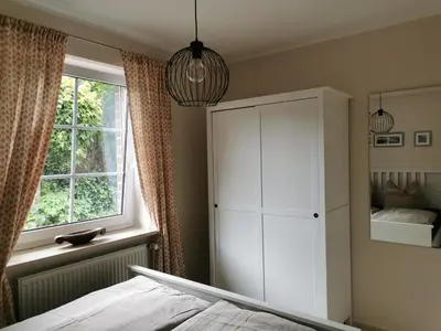 Ein Bett oder Betten in einem Zimmer der Unterkunft Entspannt Wohnen - vor den Toren Lübecks