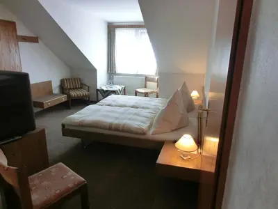 Ein Bett oder Betten in einem Zimmer der Unterkunft Hotel Hinz