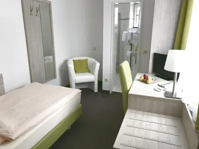 Ein Bett oder Betten in einem Zimmer der Unterkunft Hotel Hinz