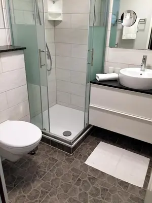Ein Badezimmer in der Unterkunft Hotel Hinz