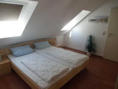 Ein Bett oder Betten in einem Zimmer der Unterkunft Gästehaus Vogelsang