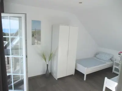 Ein Bett oder Betten in einem Zimmer der Unterkunft Gästehaus Vogelsang