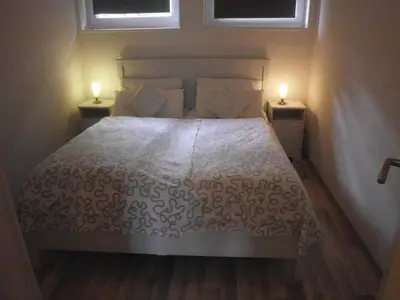Ein Bett oder Betten in einem Zimmer der Unterkunft Villa Vogelsang