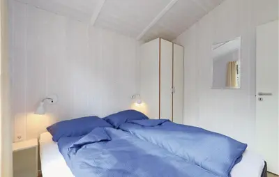 Ein Bett oder Betten in einem Zimmer der Unterkunft Frische Brise 7 - Dorf 2