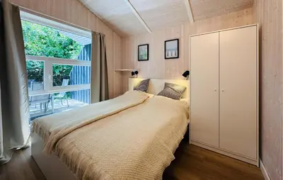 Ein Bett oder Betten in einem Zimmer der Unterkunft Morgensonne 4 - Dorf 2
