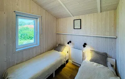Ein Bett oder Betten in einem Zimmer der Unterkunft Morgensonne 4 - Dorf 2