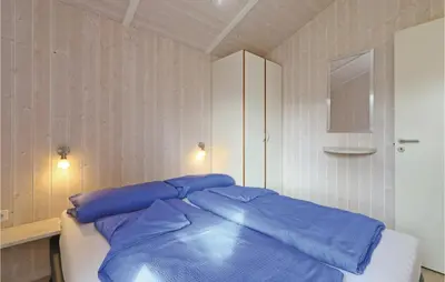 Ein Bett oder Betten in einem Zimmer der Unterkunft Abendrot 2 - Dorf 3