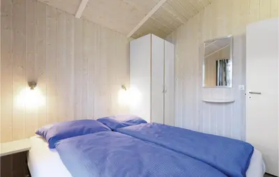 Ein Bett oder Betten in einem Zimmer der Unterkunft Abendrot 7 - Dorf 3