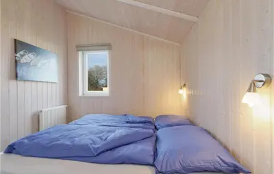 Ein Bett oder Betten in einem Zimmer der Unterkunft Abendrot 7 - Dorf 3