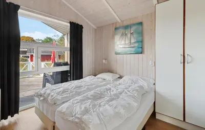Ein Bett oder Betten in einem Zimmer der Unterkunft Frische Brise 23 - Dorf 3