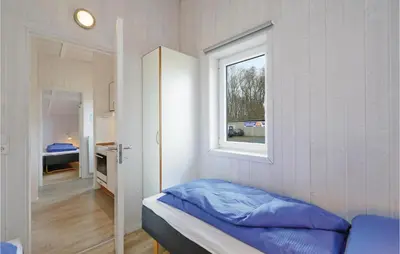 Ein Bett oder Betten in einem Zimmer der Unterkunft Frische Brise 14 - Dorf 3