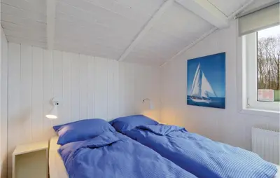 Ein Bett oder Betten in einem Zimmer der Unterkunft Frische Brise 14 - Dorf 3
