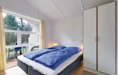 Ein Bett oder Betten in einem Zimmer der Unterkunft Frische Brise 16 - Dorf 3