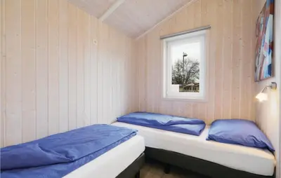 Ein Bett oder Betten in einem Zimmer der Unterkunft Frische Brise 18 - Dorf 3