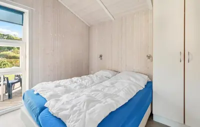 Ein Bett oder Betten in einem Zimmer der Unterkunft Dünenpark 13 - Dorf 6