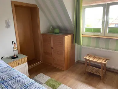 Ein Bett oder Betten in einem Zimmer der Unterkunft Ferienwohnung Röpersberg