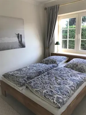 Ein Bett oder Betten in einem Zimmer der Unterkunft Strandbungalow / Ferienhaus Ostsee