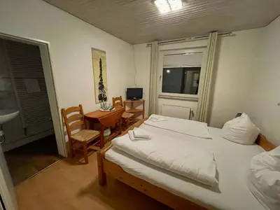Ein Bett oder Betten in einem Zimmer der Unterkunft Nobis Krug