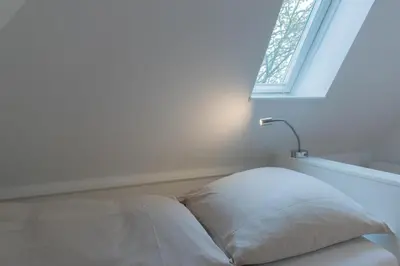 Ein Bett oder Betten in einem Zimmer der Unterkunft Ferienwohnung Villa Susewind 1