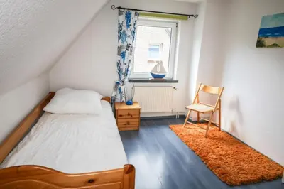 Ein Bett oder Betten in einem Zimmer der Unterkunft Ferienhaus Fischerhus Alice