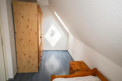 Ein Bett oder Betten in einem Zimmer der Unterkunft Ferienhaus Fischerhus Alice