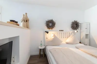 Ein Bett oder Betten in einem Zimmer der Unterkunft Ferienwohnung Diike