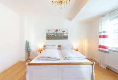 Ein Bett oder Betten in einem Zimmer der Unterkunft Ferienwohnung Alte Liebe 1