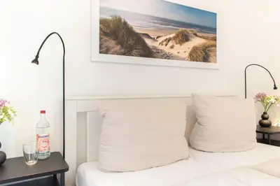 Ein Bett oder Betten in einem Zimmer der Unterkunft Ferienwohnung App. 1 Haus Duckdalben