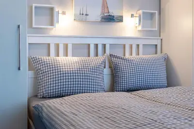 Ein Bett oder Betten in einem Zimmer der Unterkunft Ferienwohnung Bodo´s Strandkorb