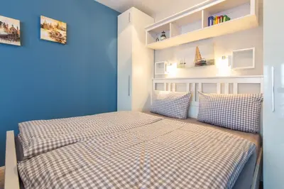Ein Bett oder Betten in einem Zimmer der Unterkunft Ferienwohnung Bodo´s Strandkorb