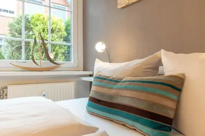 Ein Bett oder Betten in einem Zimmer der Unterkunft Ferienwohnung Ausspann