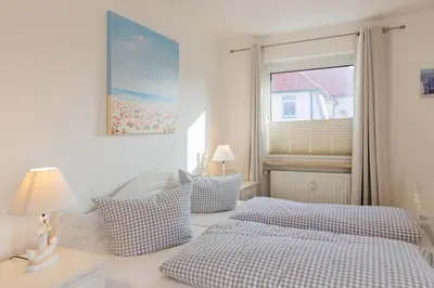 Ein Bett oder Betten in einem Zimmer der Unterkunft Ferienwohnung Austernfischer