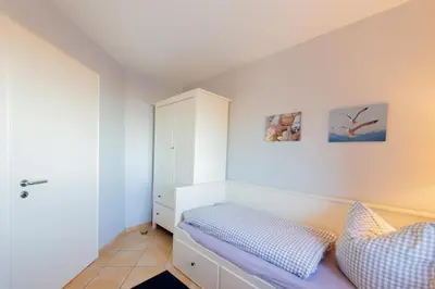 Ein Bett oder Betten in einem Zimmer der Unterkunft Ferienwohnung Austernfischer