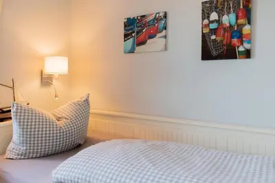 Ein Bett oder Betten in einem Zimmer der Unterkunft Ferienwohnung Austernfischer