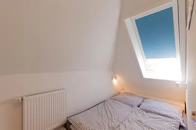 Ein Bett oder Betten in einem Zimmer der Unterkunft Ferienwohnung Ostseenest