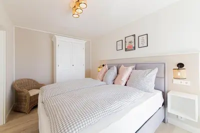 Ein Bett oder Betten in einem Zimmer der Unterkunft Ferienwohnung Seesand No.08