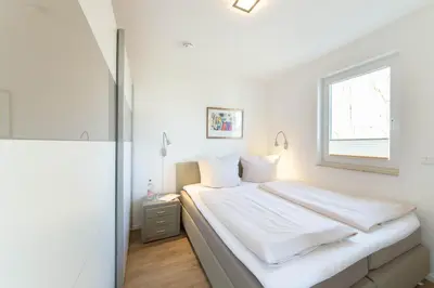 Ein Bett oder Betten in einem Zimmer der Unterkunft Ferienwohnung Lotsenwache