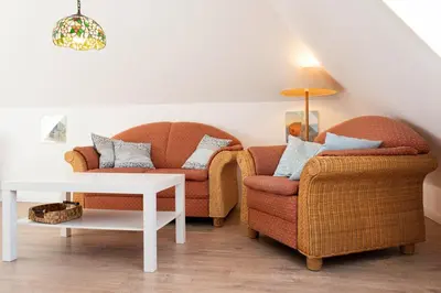 Ein Sitzbereich in der Unterkunft Ferienwohnung App.11 Haus Duckdalben