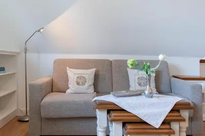 Ein Sitzbereich in der Unterkunft Ferienwohnung Lachmöwe