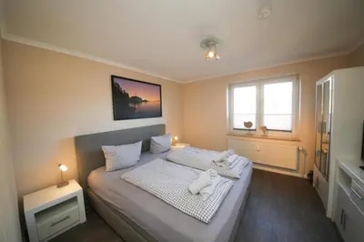 Ein Bett oder Betten in einem Zimmer der Unterkunft Ferienwohnung Küstenzauber
