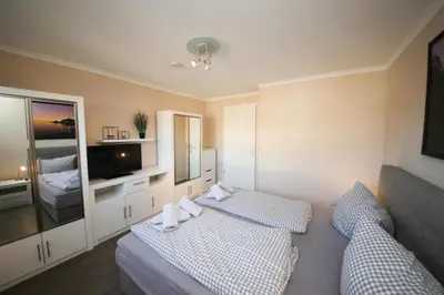 Ein Bett oder Betten in einem Zimmer der Unterkunft Ferienwohnung Küstenzauber