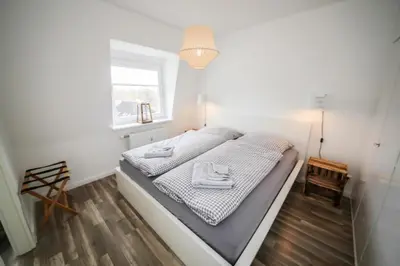 Ein Bett oder Betten in einem Zimmer der Unterkunft Ferienwohnung LEE im Haus Demory