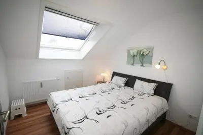 Ein Bett oder Betten in einem Zimmer der Unterkunft Ferienwohnung Meeresblick
