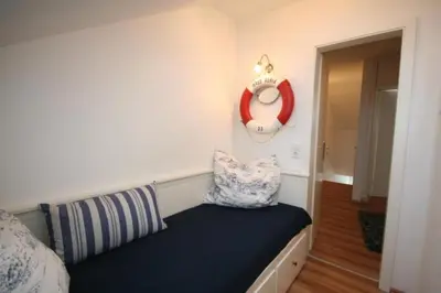 Ein Bett oder Betten in einem Zimmer der Unterkunft Ferienwohnung Meeresblick