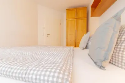 Ein Bett oder Betten in einem Zimmer der Unterkunft Ferienwohnung Strandroggen