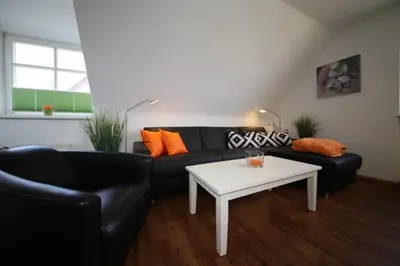 Ein Sitzbereich in der Unterkunft Ferienwohnung Kutter Haus Duckdalben