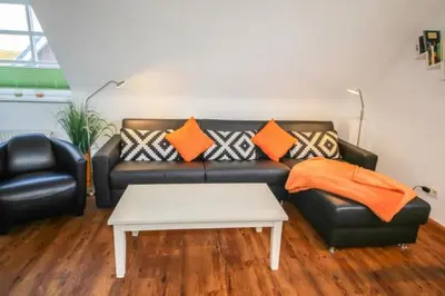 Ein Sitzbereich in der Unterkunft Ferienwohnung Kutter Haus Duckdalben